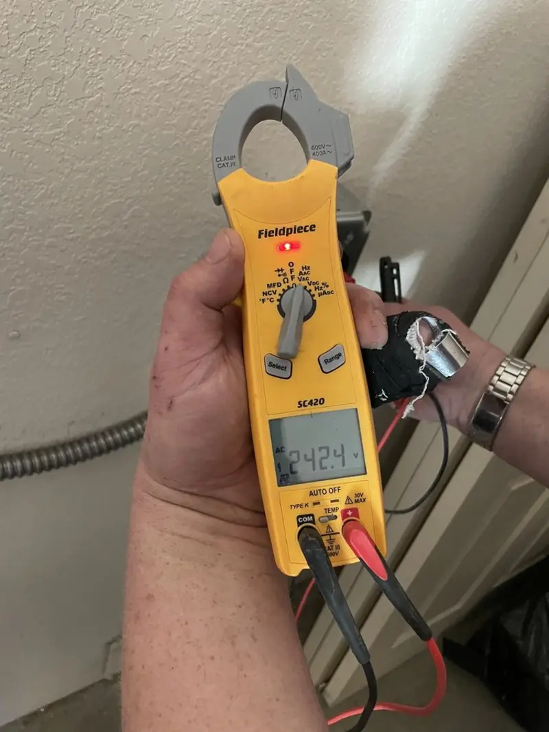 Voltage testing with clamp meter during Whole House Surge Protector in Sealy